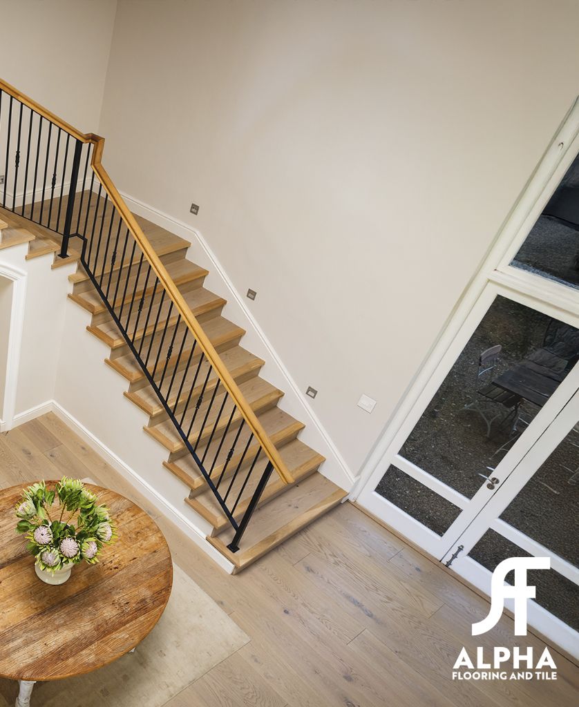 Hardwood staircase and hardwood floors from above