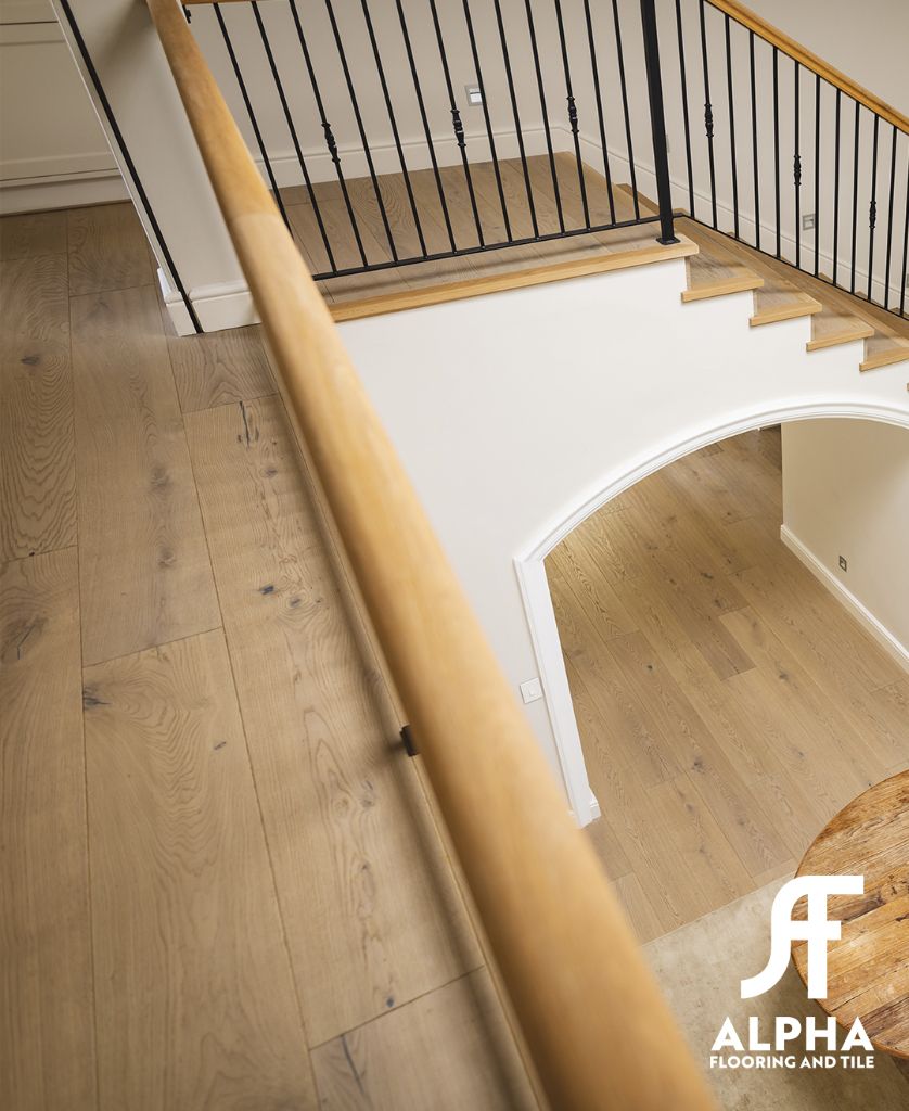 Wood floor landing with iron railing